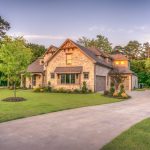 House with perfectly mowed driveway