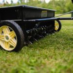 lawn aerator attached behind riding mower